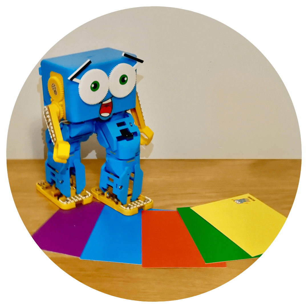 Marty the Robot walking on instructional coloured cards