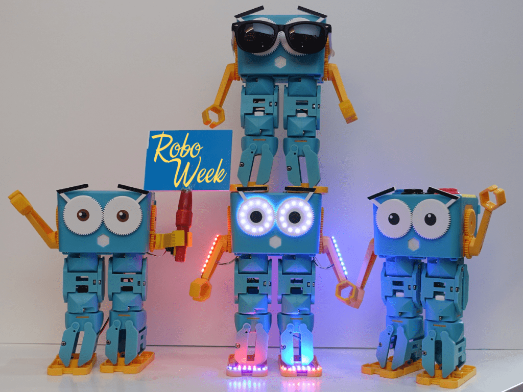 Marty the robot pyramid with bottom left robot holding a sign saying "Robo Week"